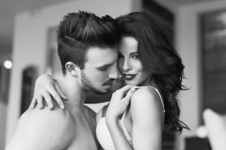 Sexy couple foreplay indoor black and white