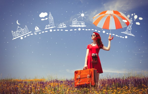 girl in red dress with umbrella and suitcase